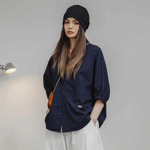 Women's 3/4 sleeve loose blouse with batwing casual design and stand collar in solid color, perfect for spring and summer.